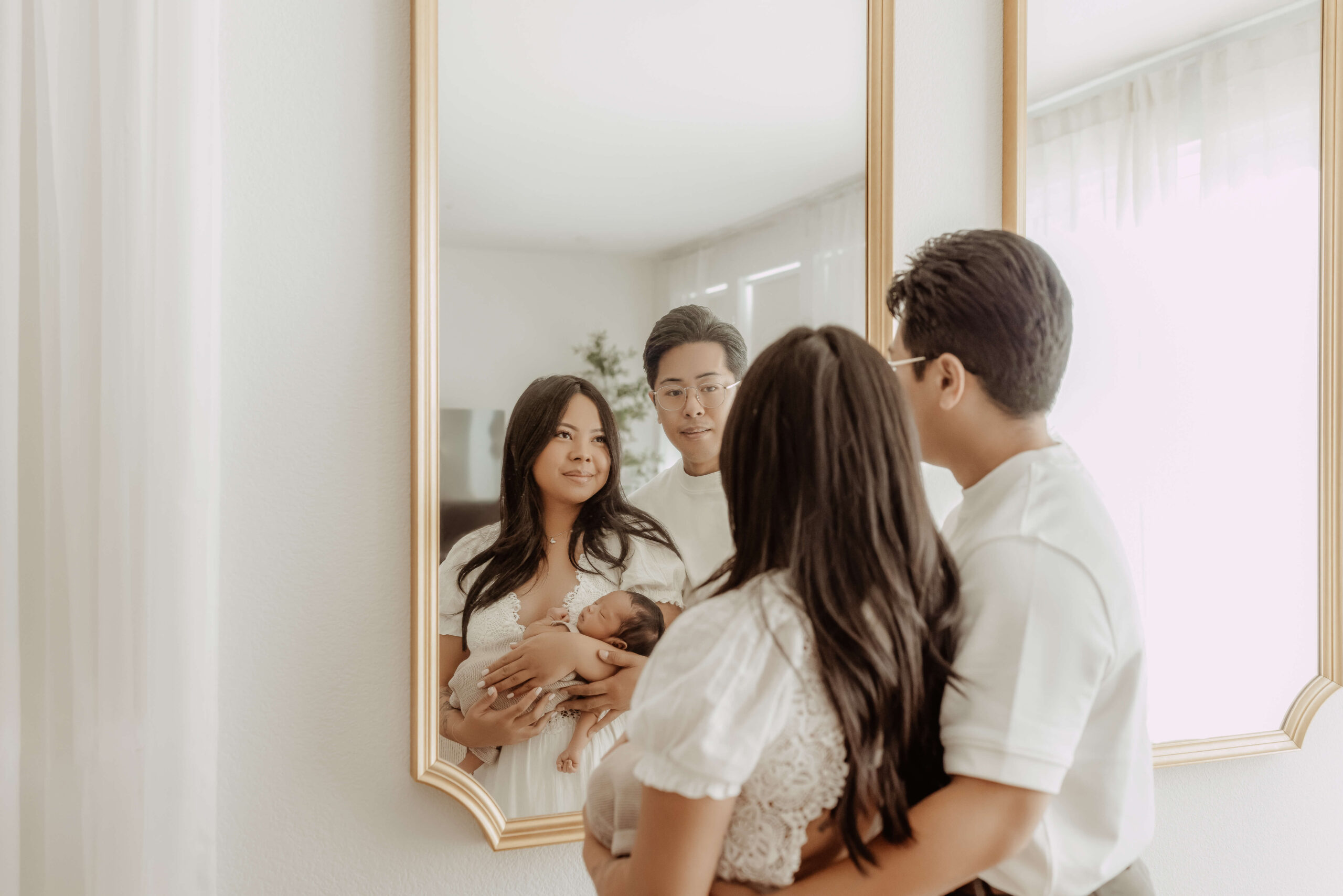 Parents holding their newborn baby